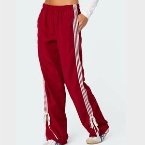 Red Track Pants with White Stripes